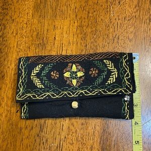 Fabric pouch/wallet. Embroidered design with elephant on back.  Lightly padded.